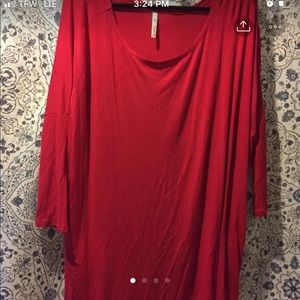 Red piko top with pockets. Tunic length